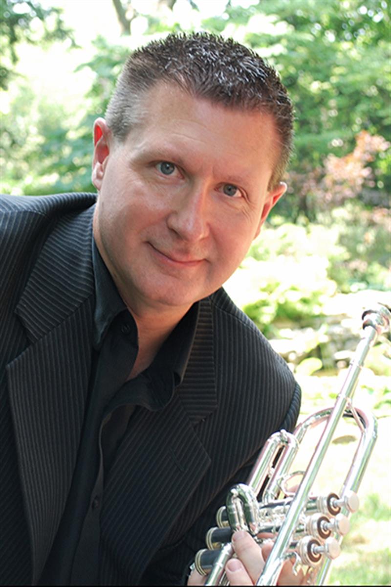 Mark Clodfelter holding a trumpet
