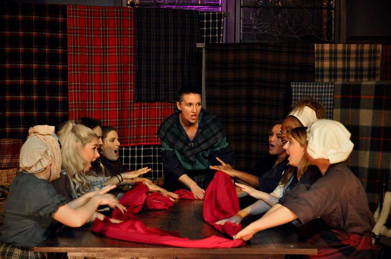 a group of women with plaid cloth