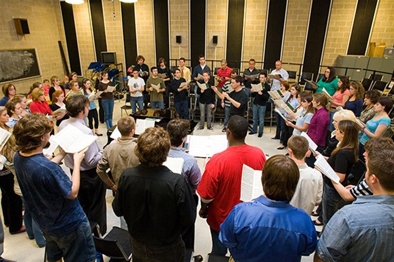 choir rehearsing in a circle
