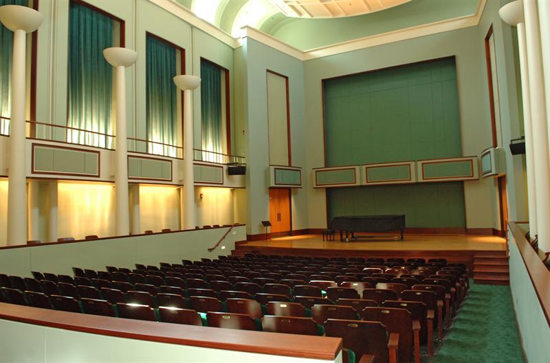 Gore recital hall with a piano on stage