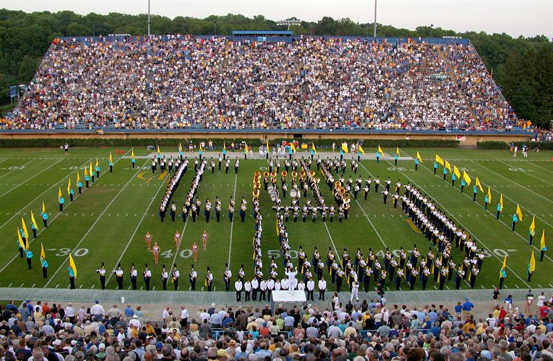 marching band in UD formation on football field