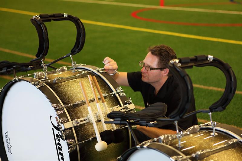 jim ancona inspects a bass drum