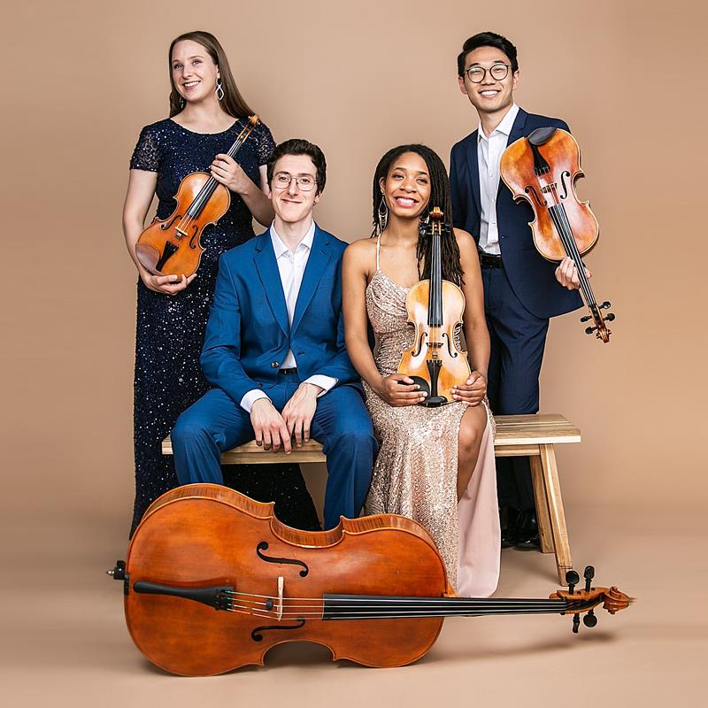 members of the abeo quartet holding string instruments