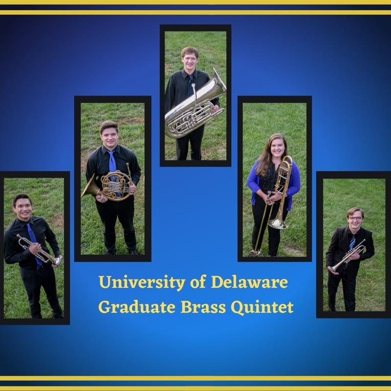 students standing on grass holding brass instruments